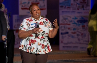 Lady speaking at an event