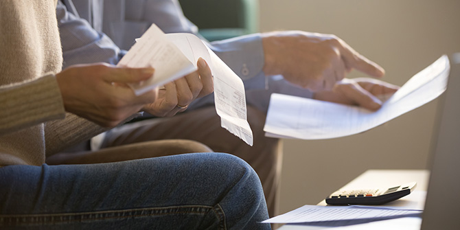 Hands reviewing receipts