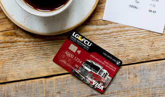 LGFCU Firefighers' Debit Card on a table at a coffeeshop.