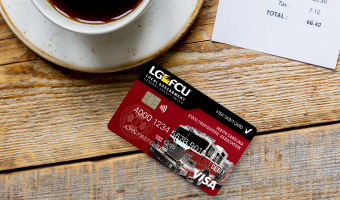 LGFCU Firefighers' Debit Card on a table at a coffeeshop.