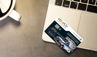LGFCU Rescue/EMS Debit Card sitting on a laptop