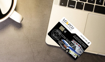 LGFCU Rescue/EMS Debit Card sitting on a laptop