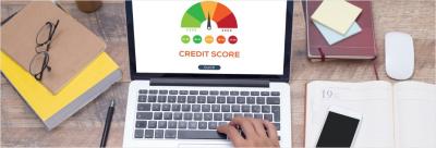 Laptop with chart of credit score ranges