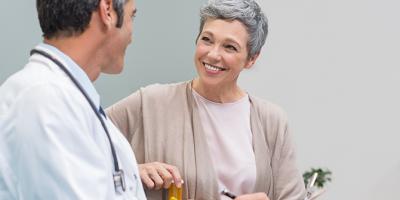 Elderly lady speaking to doctor.