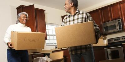 Senior couple packing up their kitchen