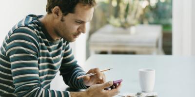 Man using a calculator