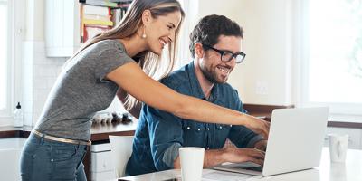 Man and woman looking at laptop