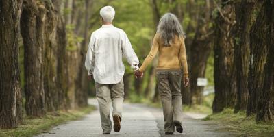 Couple walking down the street holding hands