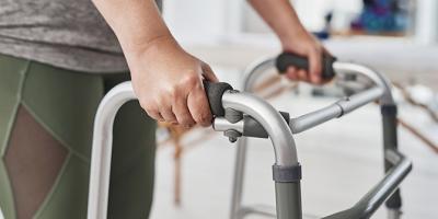 Female hands on a walker