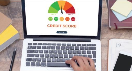 Laptop with chart of credit score ranges