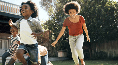 family playing in back yard