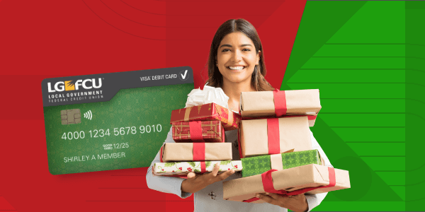Smiling woman holding gifts and credit card