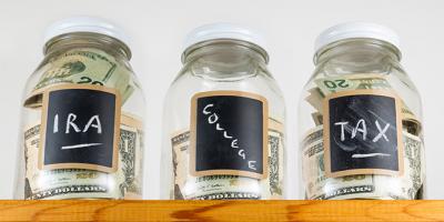 Three jars labeled “IRA,” “College,” and “Tax”