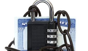 Lock and chain around a Social Security card