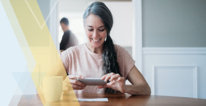 Woman depositing check with phone